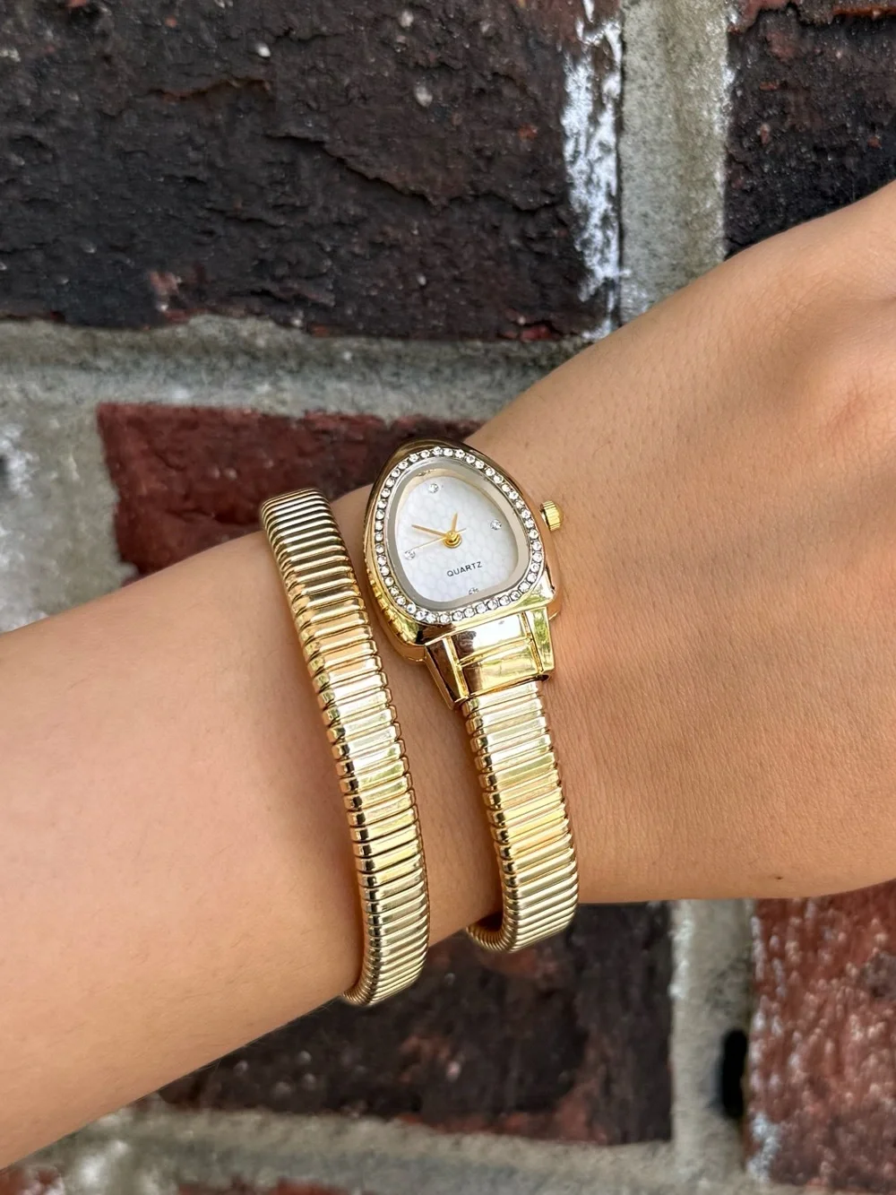 Gold serpentine bracelet watch